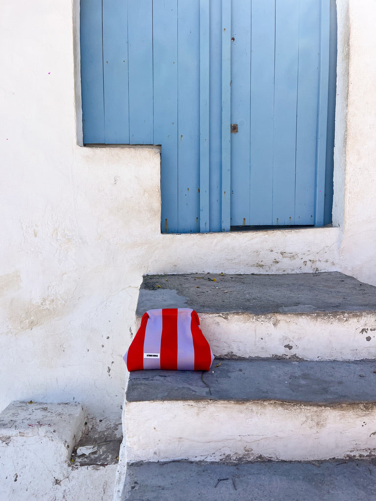 Nools clutch stripe lila/red