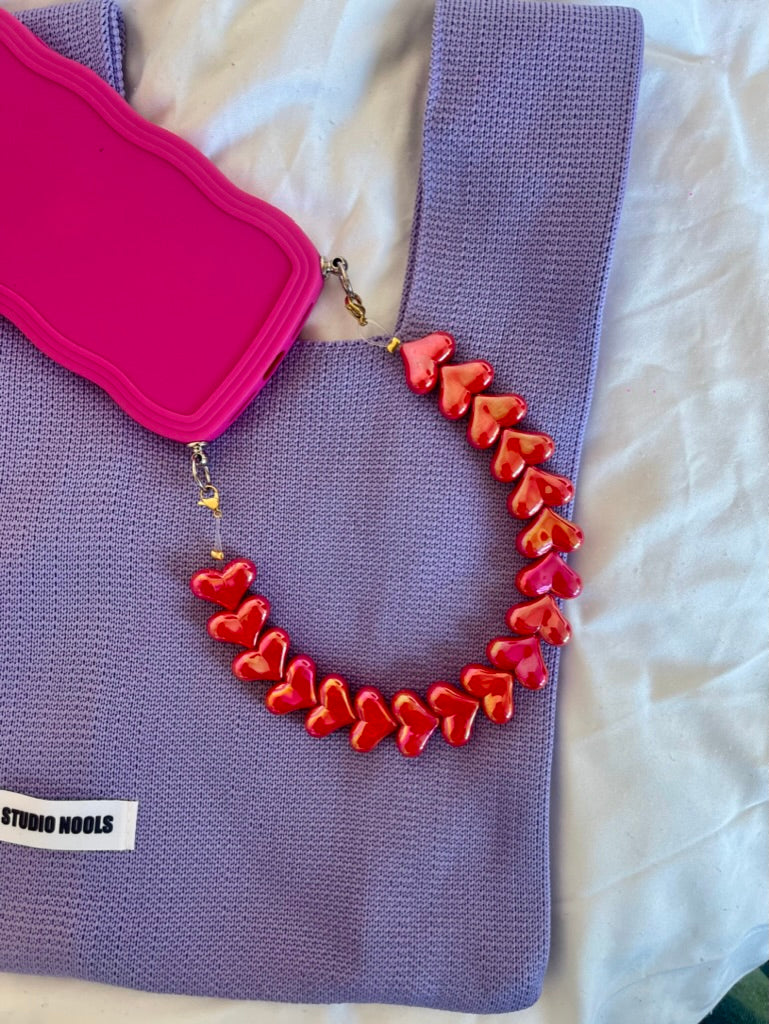 Heart phone cord shiny koraal glanzend hartjes telefoonkoord statement accessoire Nools

Heart phone cord shiny coral glossy heart phone cord statement accessory Nools